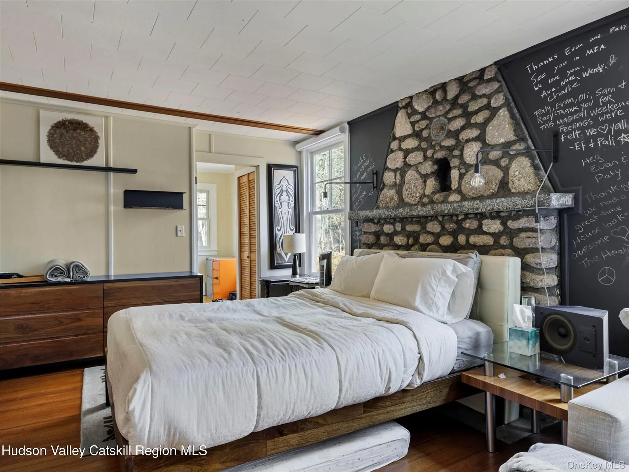 Bedroom featuring wood finished floors Bedroom featuring wood finished floors