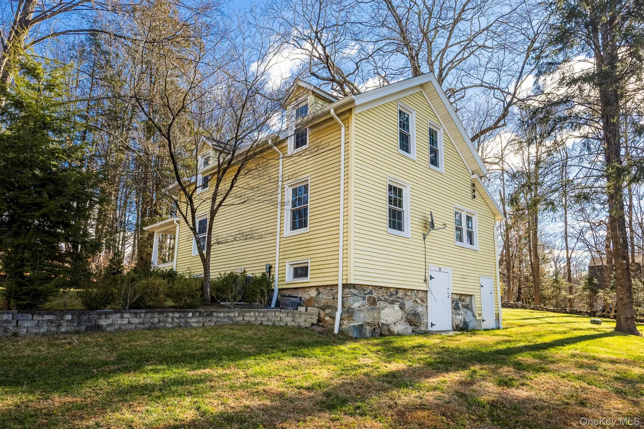 View of home's exterior featuring a yard View of home's exterior featuring a yard