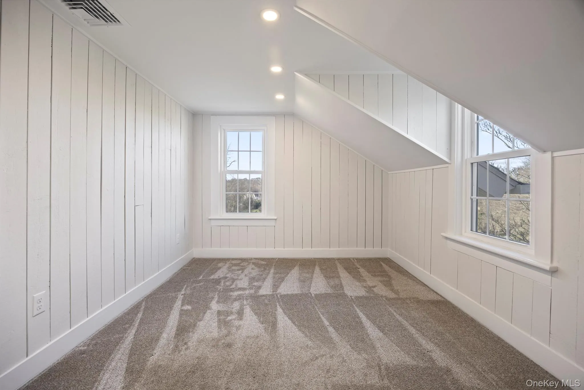Bedroom #2 with carpet floors, recessed lighting, wood walls. Bedroom #2 with carpet floors, recessed lighting, wood walls.
