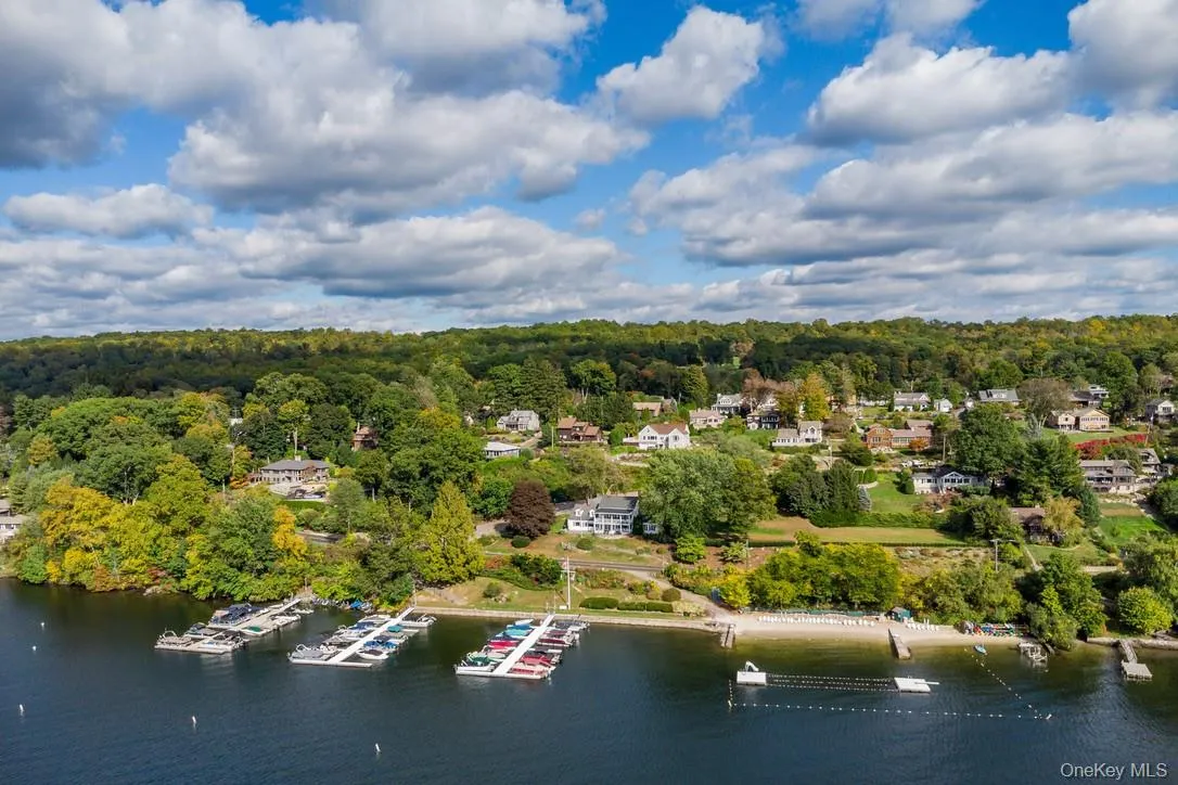Aerial view of a large body of water and a heavily wooded area Aerial view of a large body of water and a heavily wooded area