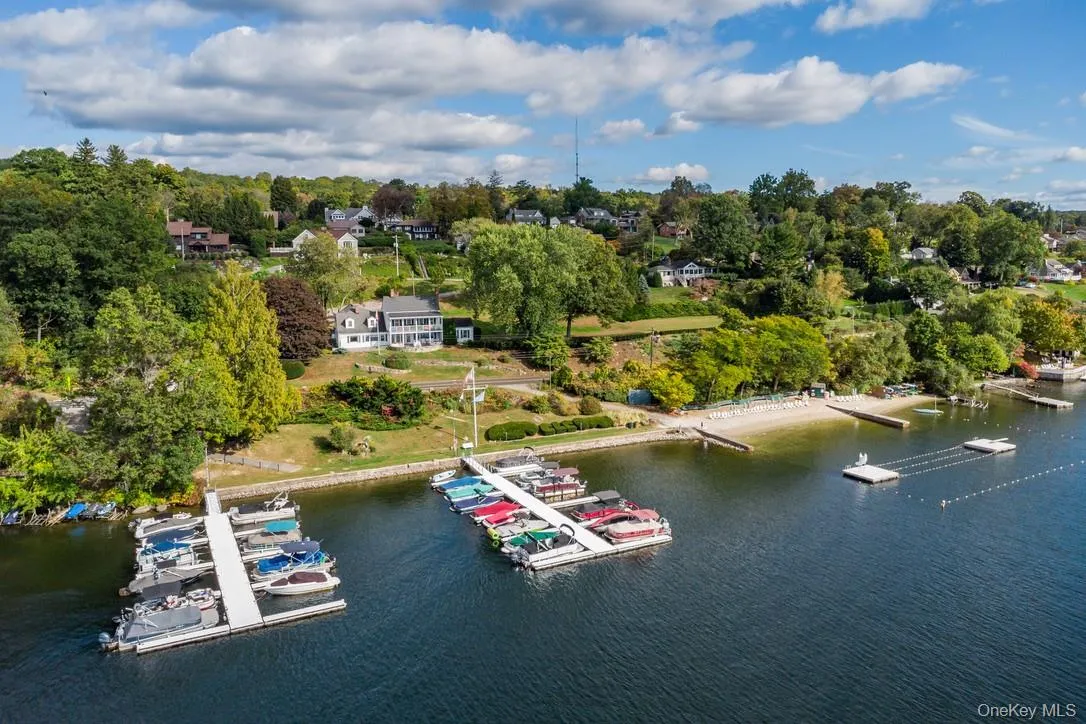 Bird's eye view of a large body of water and a tree filled landscape Bird's eye view of a large body of water and a tree filled landscape