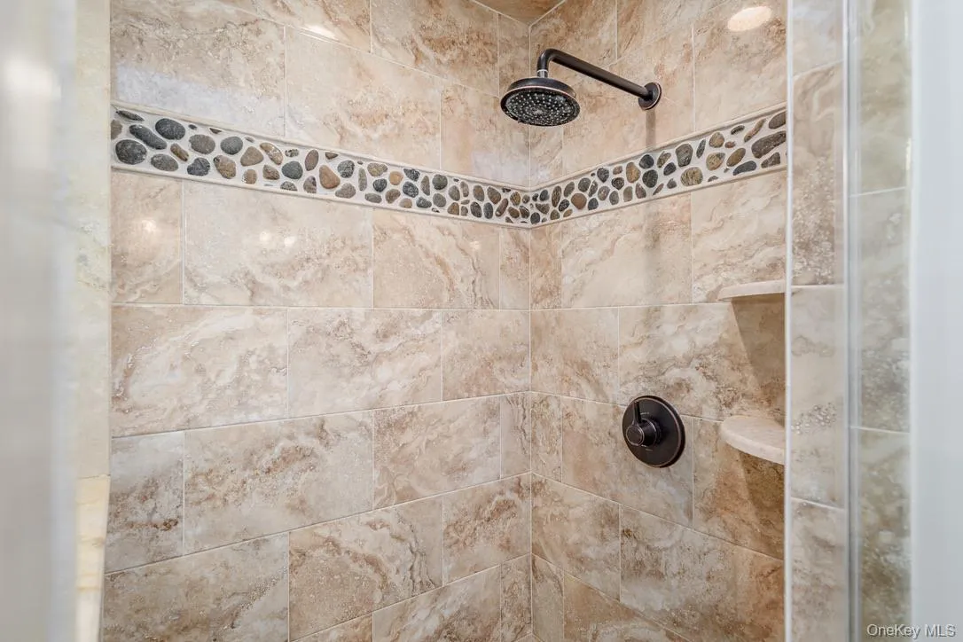 Bathroom view of a tile shower Bathroom view of a tile shower