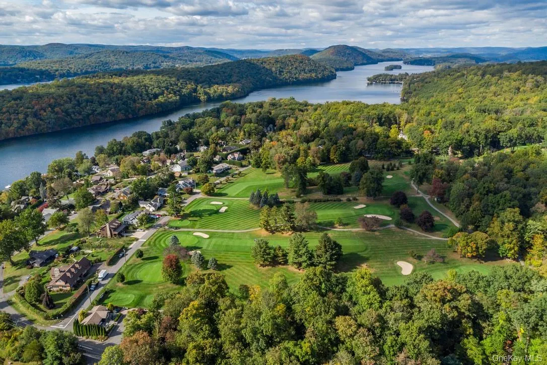 Bird's eye view of a water and mountain view and a local golf course Bird's eye view of a water and mountain view and a local golf course