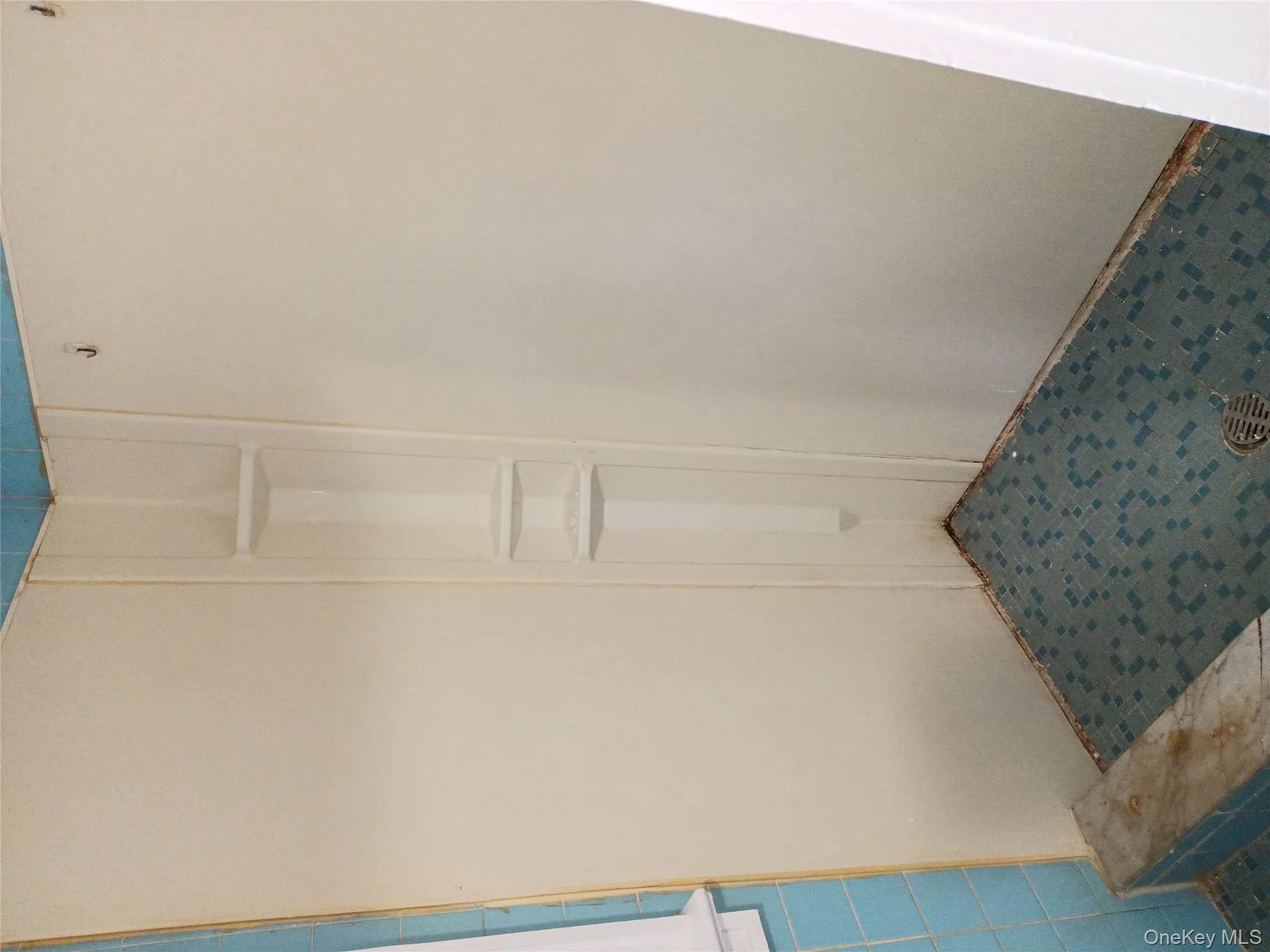 Full bath featuring a shower stall Full bath featuring a shower stall