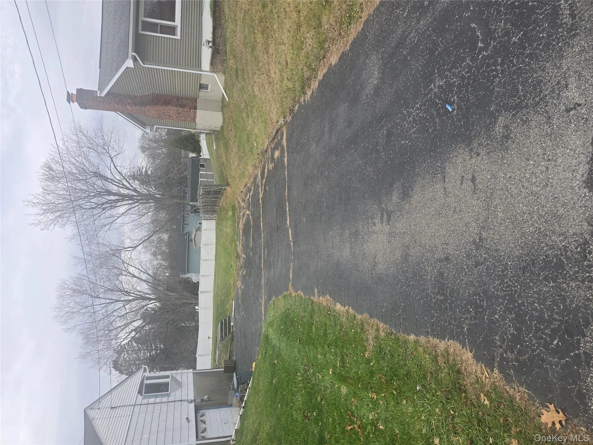 View of asphalt driveway View of asphalt driveway