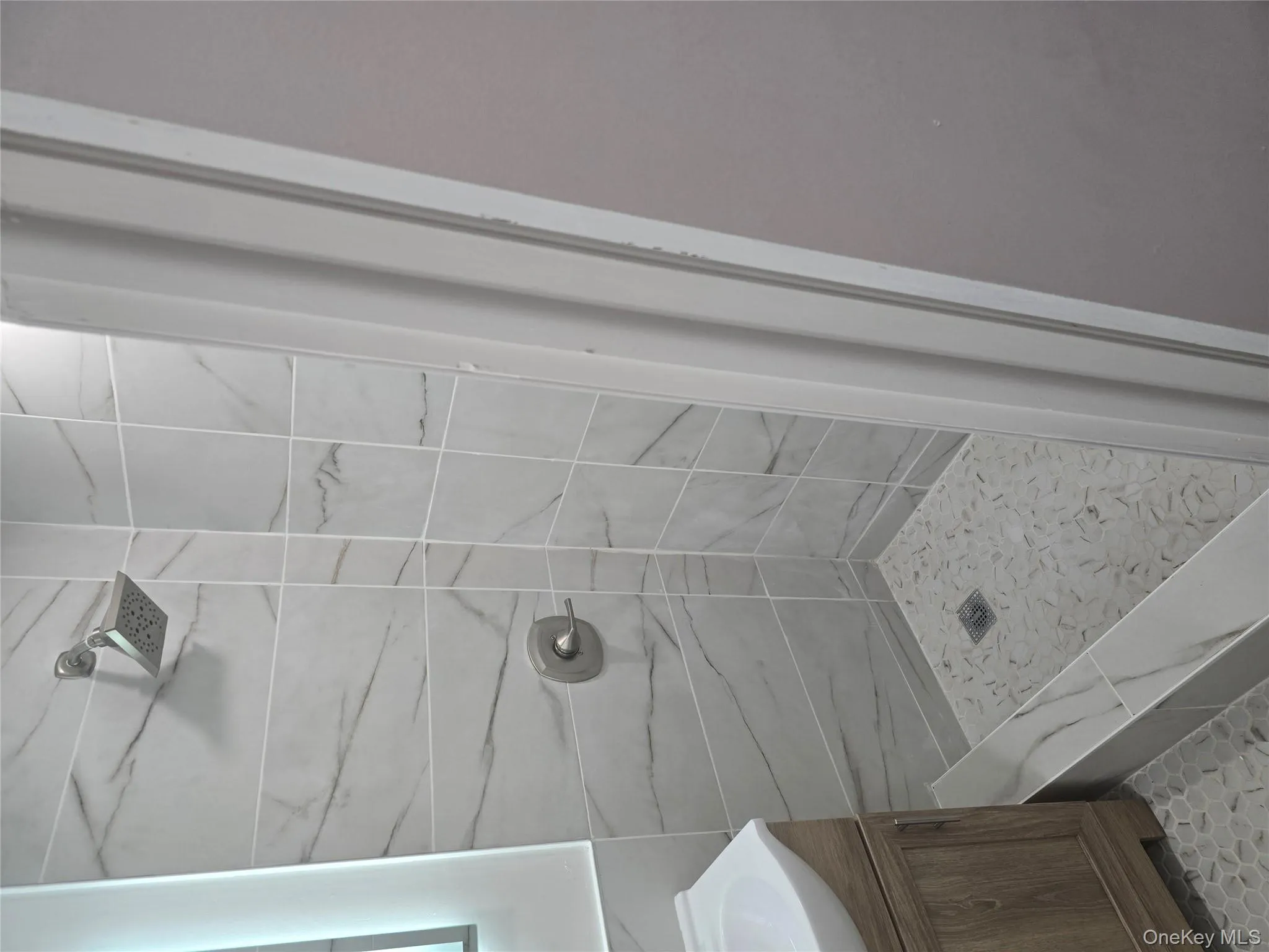 Bathroom with a shower stall and vanity Bathroom with a shower stall and vanity