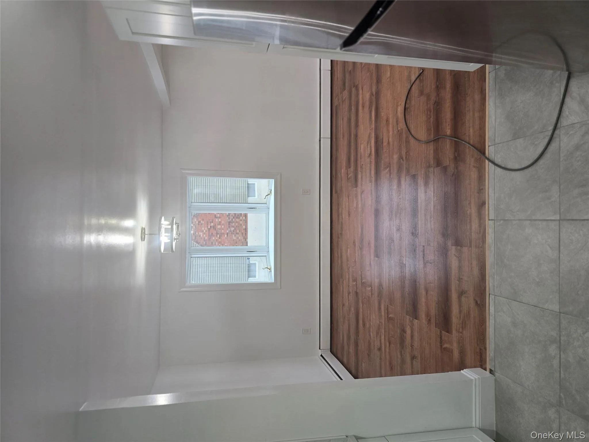 Unfurnished dining area with tile patterned flooring and a baseboard radiator Unfurnished dining area with tile patterned flooring and a baseboard radiator