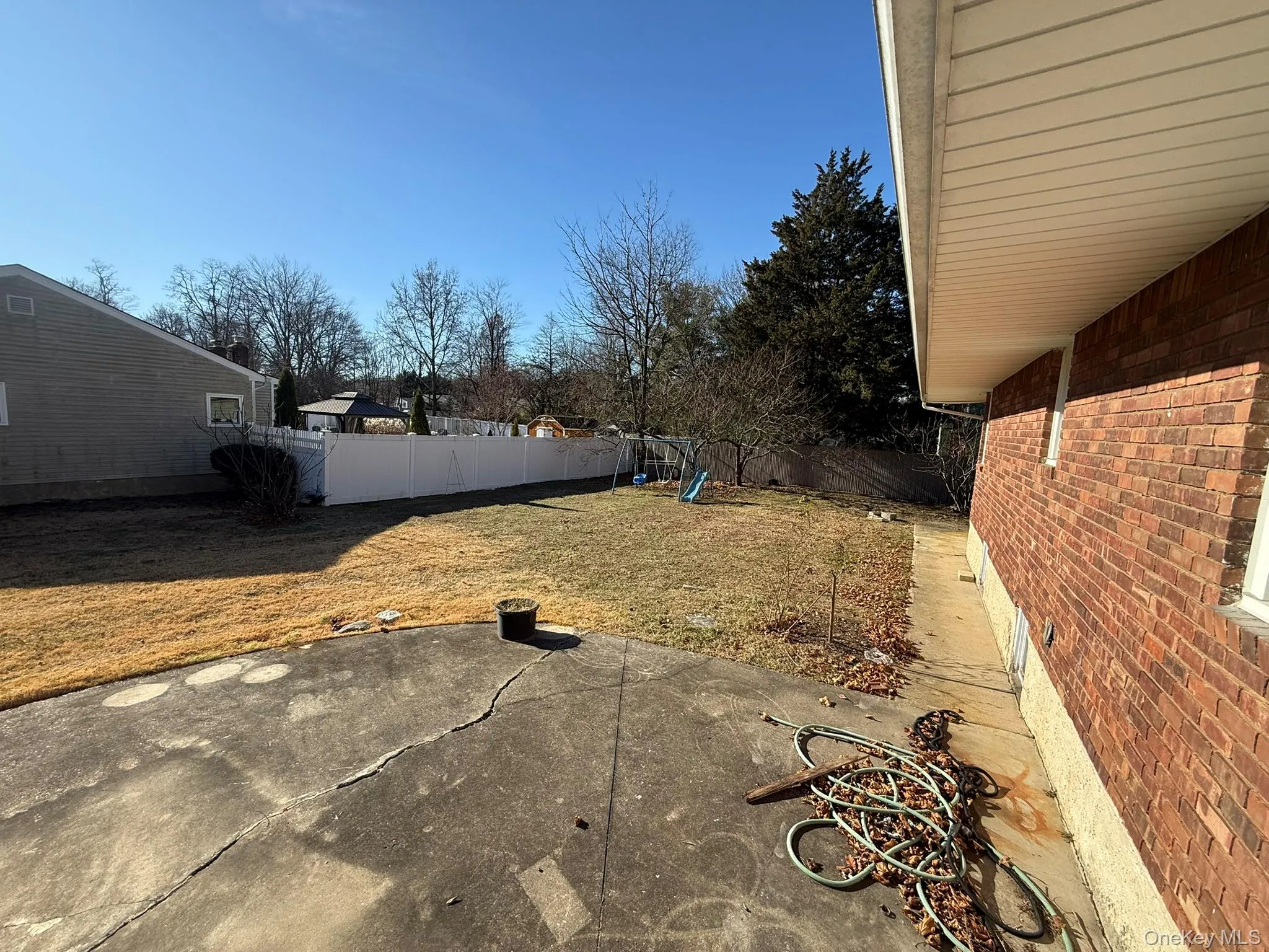 Fenced backyard with a patio Fenced backyard with a patio