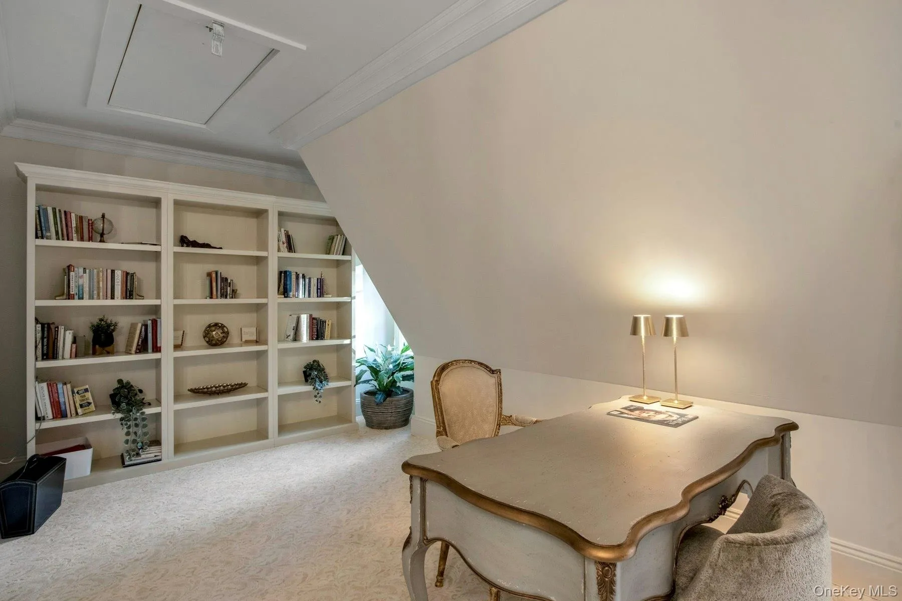 Carpeted office with lofted ceiling and ornamental molding Carpeted office with lofted ceiling and ornamental molding