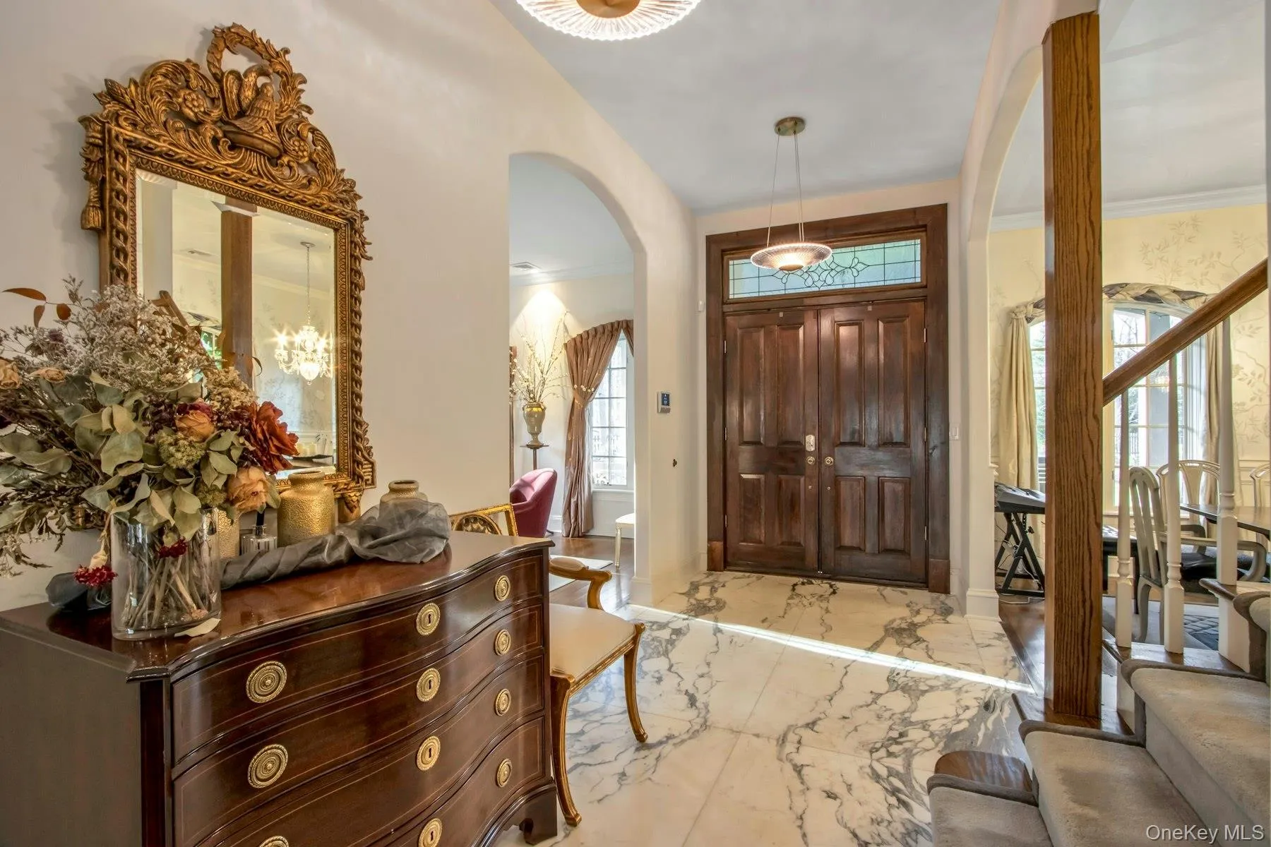 Foyer entrance featuring ornamental molding Foyer entrance featuring ornamental molding