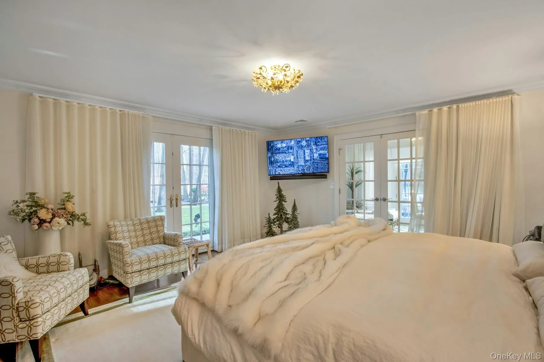 Bedroom with access to exterior, french doors, multiple windows, and ornamental molding Bedroom with access to exterior, french doors, multiple windows, and ornamental molding