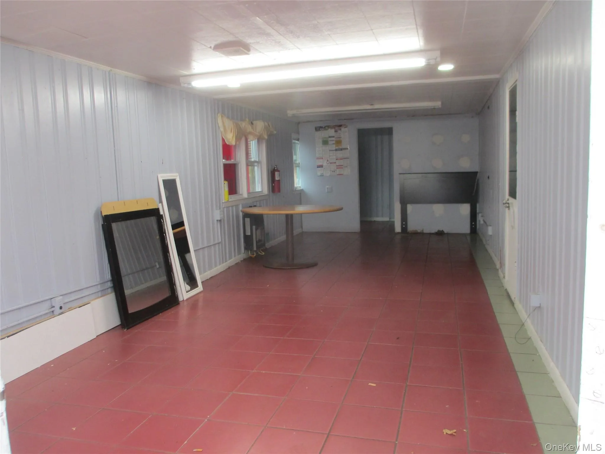 Below grade area with tile patterned flooring Below grade area with tile patterned flooring