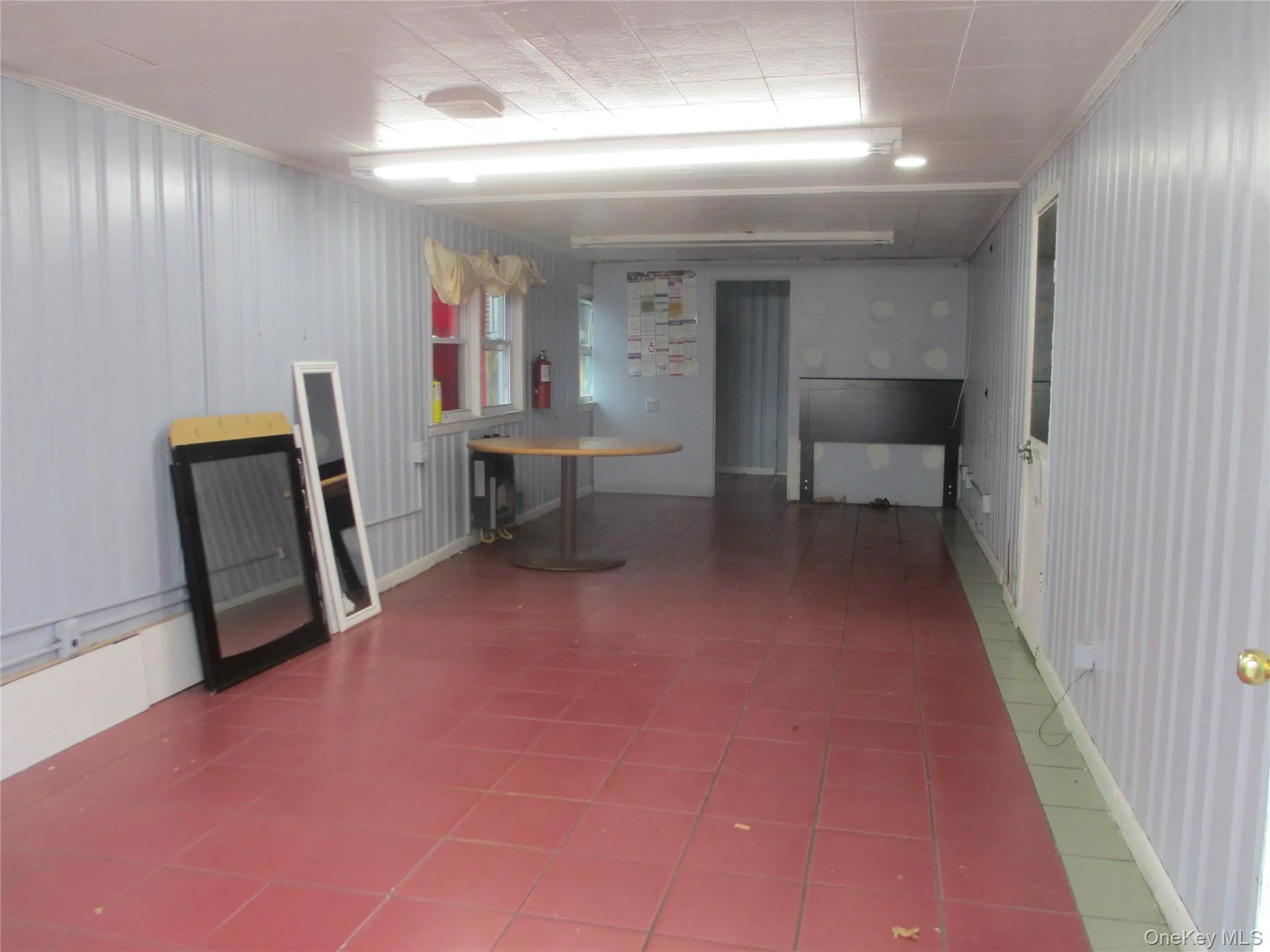 Below grade area with tile patterned flooring Below grade area with tile patterned flooring