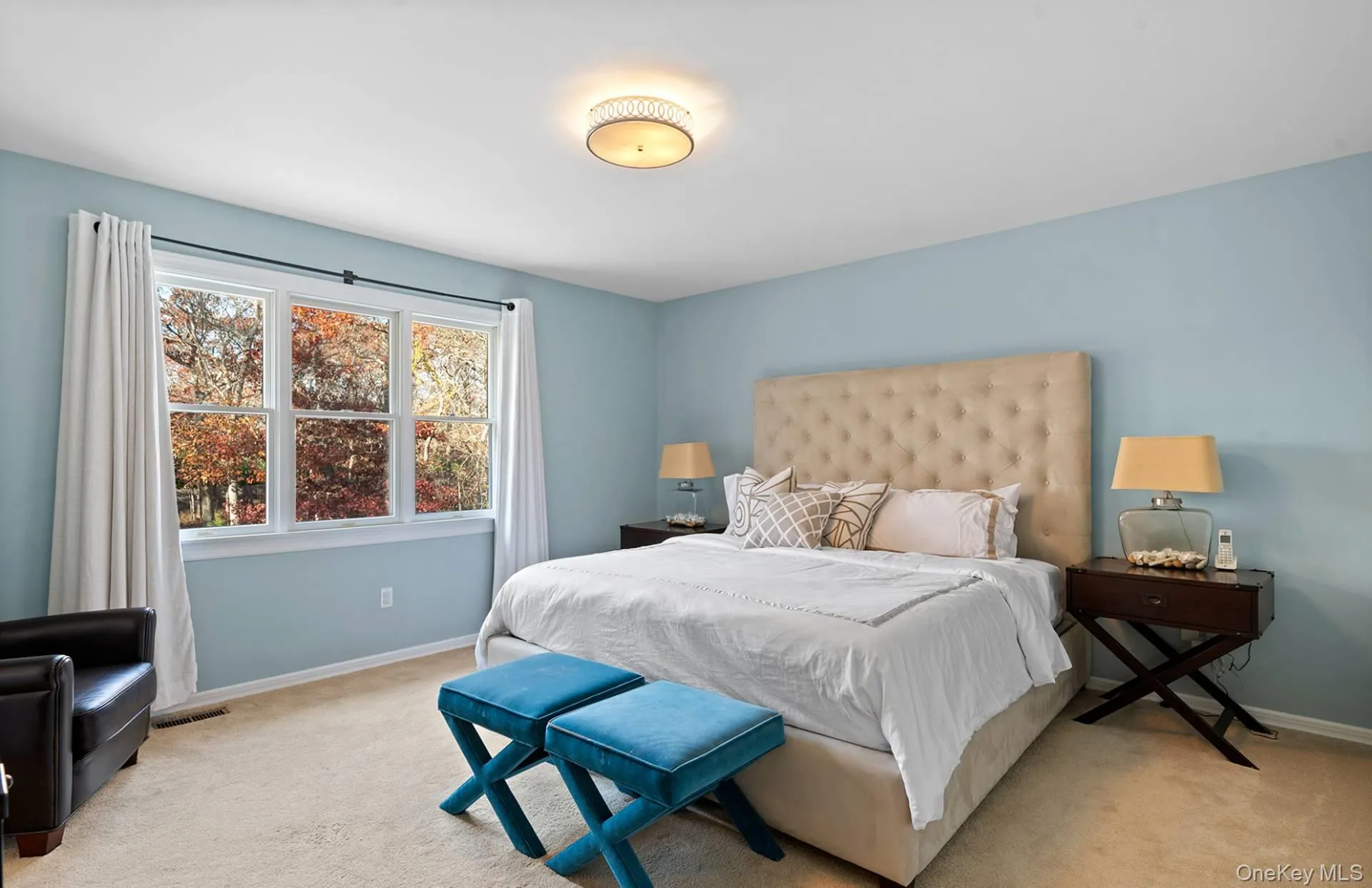 Bedroom featuring light colored carpet Bedroom featuring light colored carpet