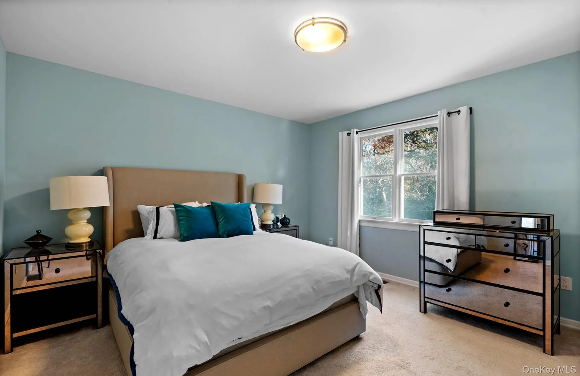 Bedroom featuring carpet flooring and baseboards Bedroom featuring carpet flooring and baseboards