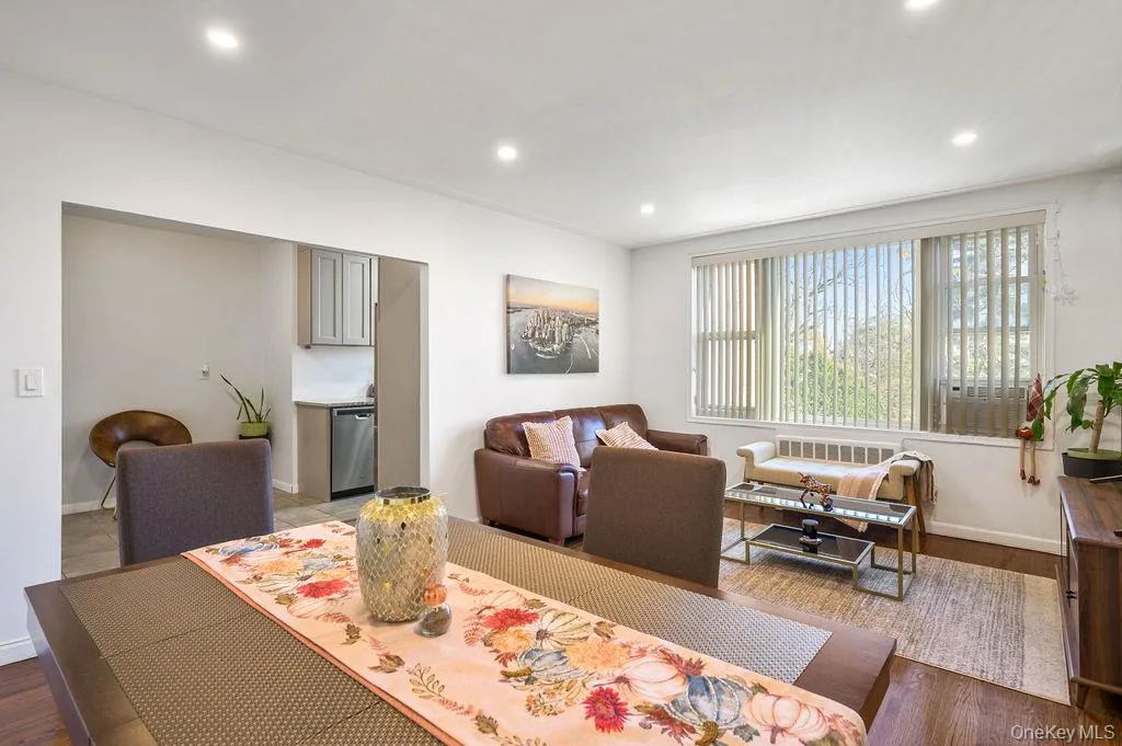 Dining space featuring wood finished floors and recessed lighting Dining space featuring wood finished floors and recessed lighting