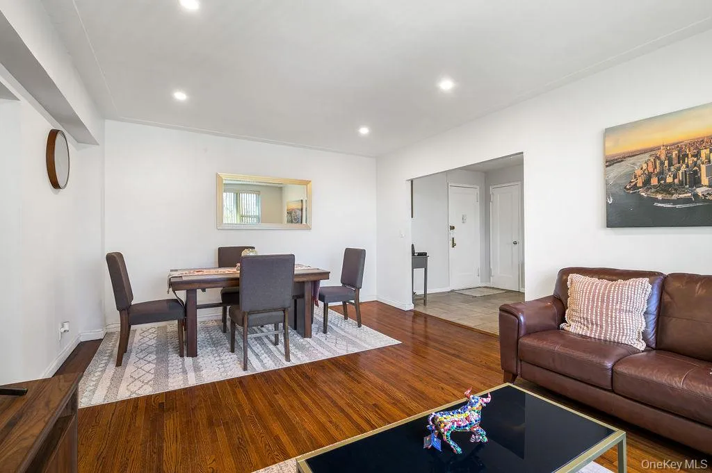 Dining space with dark wood finished floors and recessed lighting Dining space with dark wood finished floors and recessed lighting