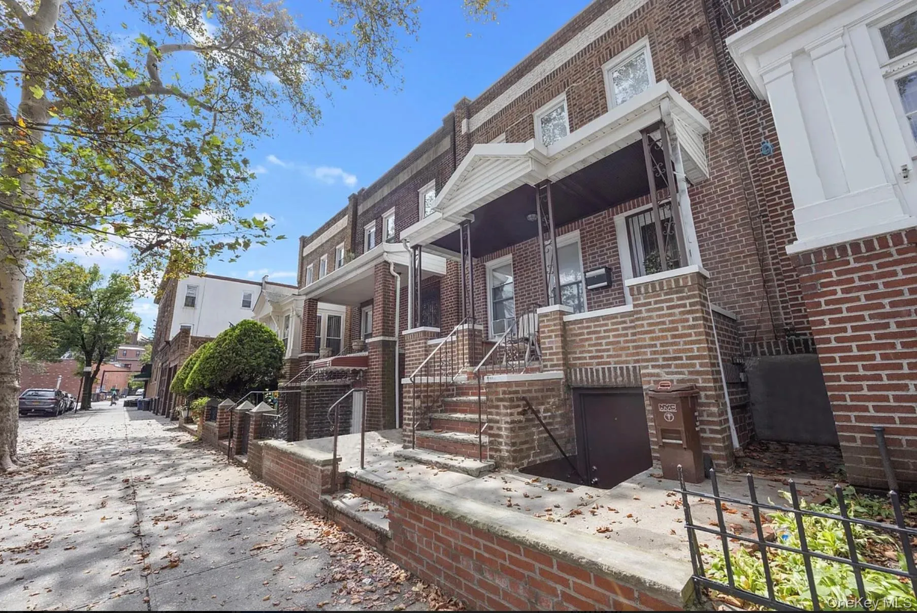 View of front facade featuring brick siding and covered porch View of front facade featuring brick siding and covered porch