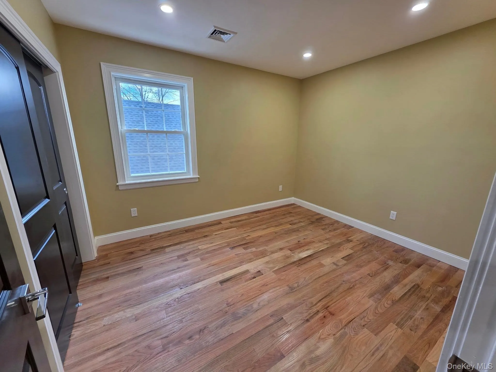 Unfurnished bedroom featuring light wood-type flooring, a closet, and recessed lighting Unfurnished bedroom featuring light wood-type flooring, a closet, and recessed lighting
