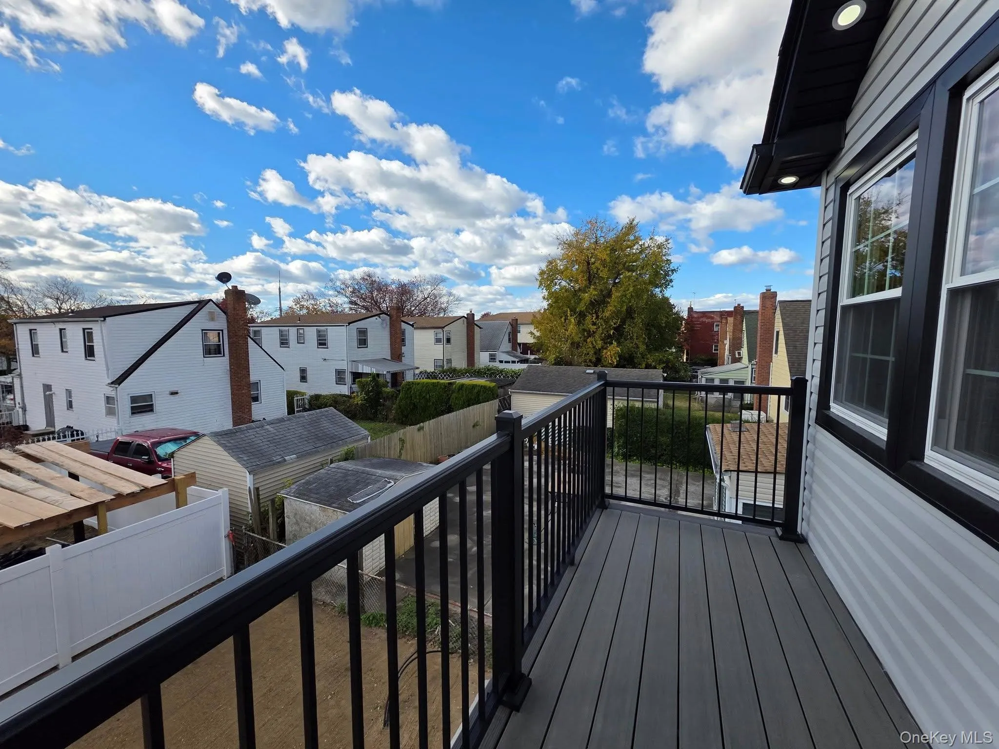 Wooden terrace featuring a residential view Wooden terrace featuring a residential view
