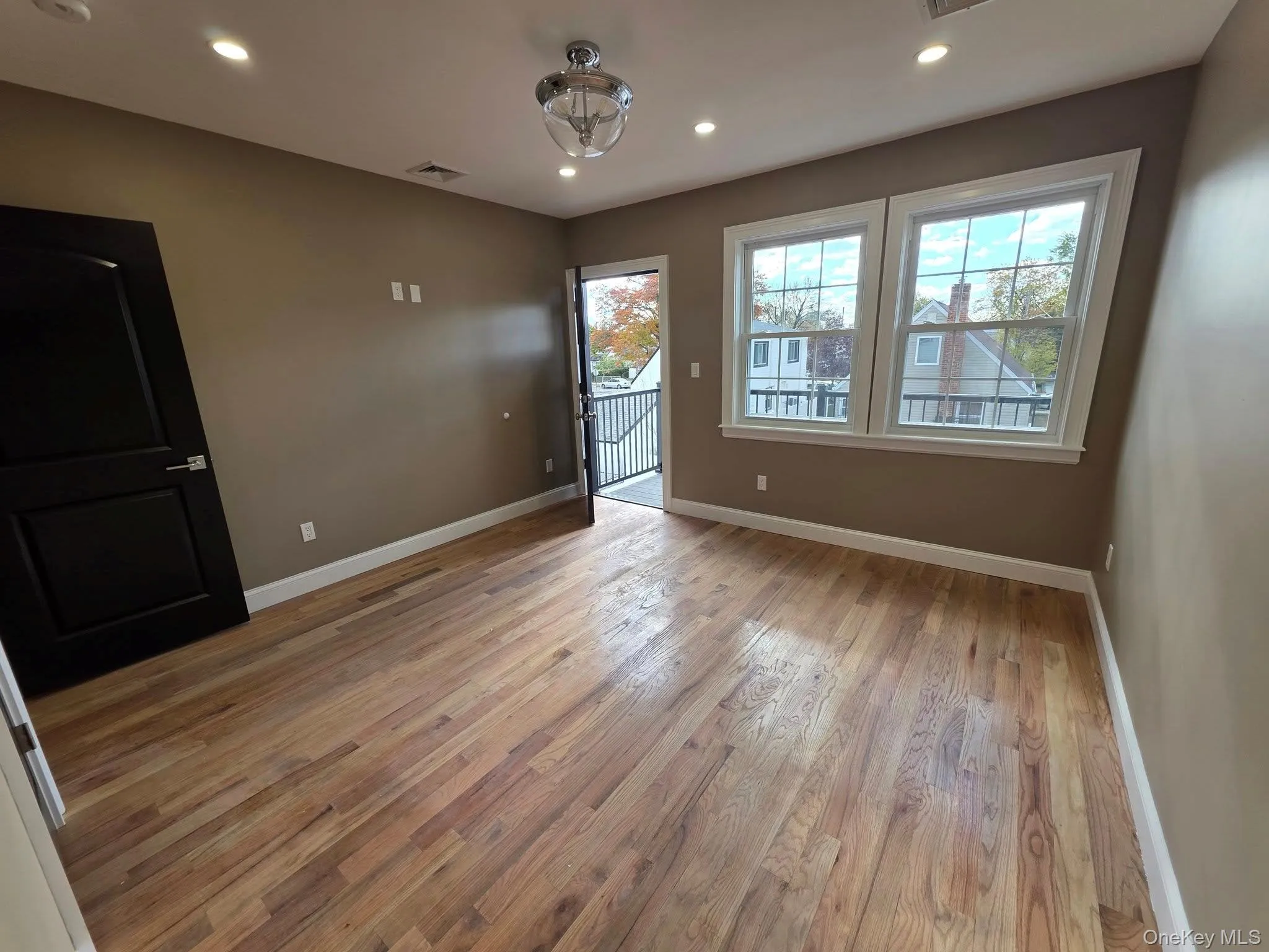 Unfurnished room featuring recessed lighting and light wood finished floors Unfurnished room featuring recessed lighting and light wood finished floors