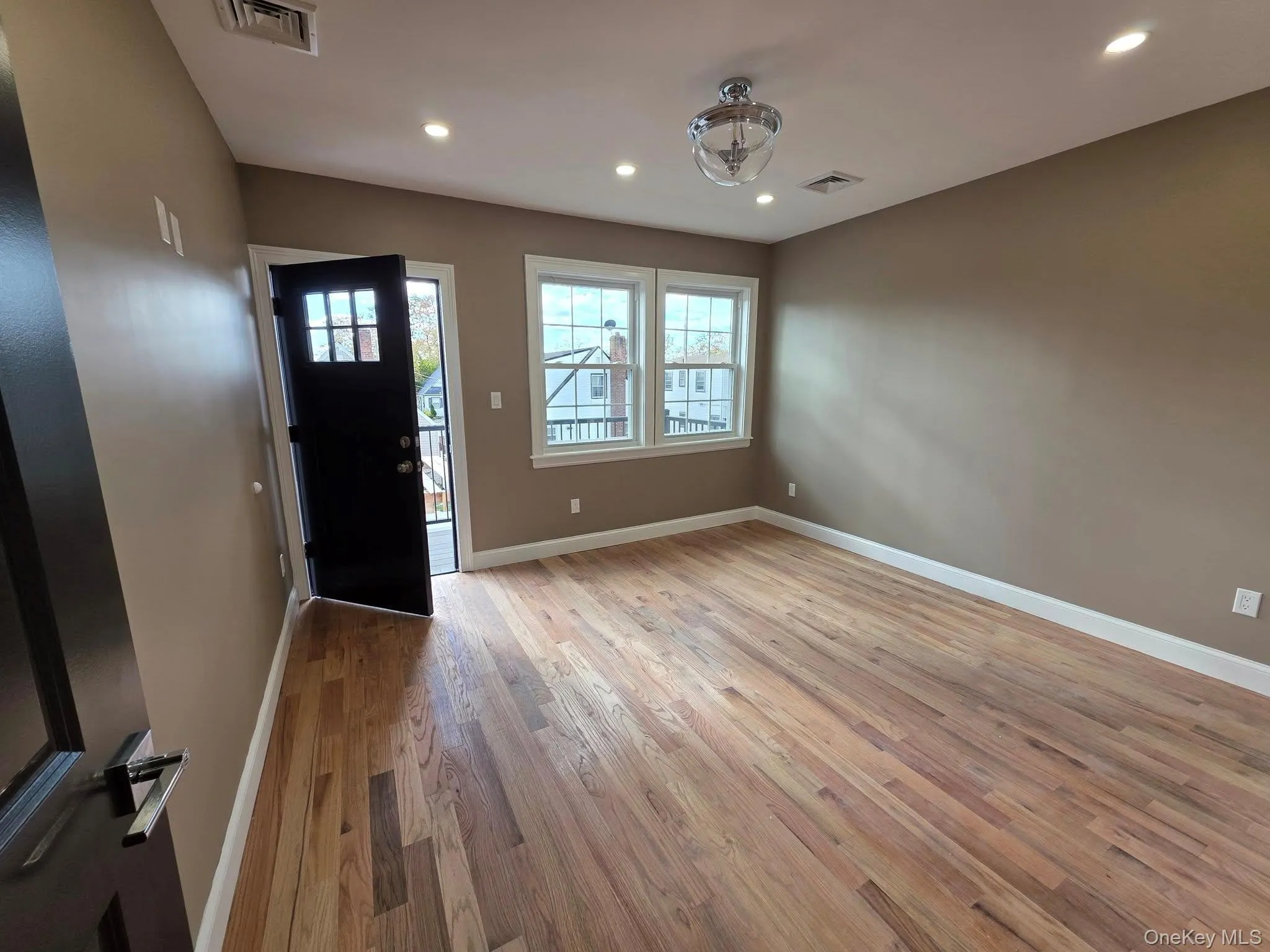 Foyer featuring light wood finished floors and recessed lighting Foyer featuring light wood finished floors and recessed lighting