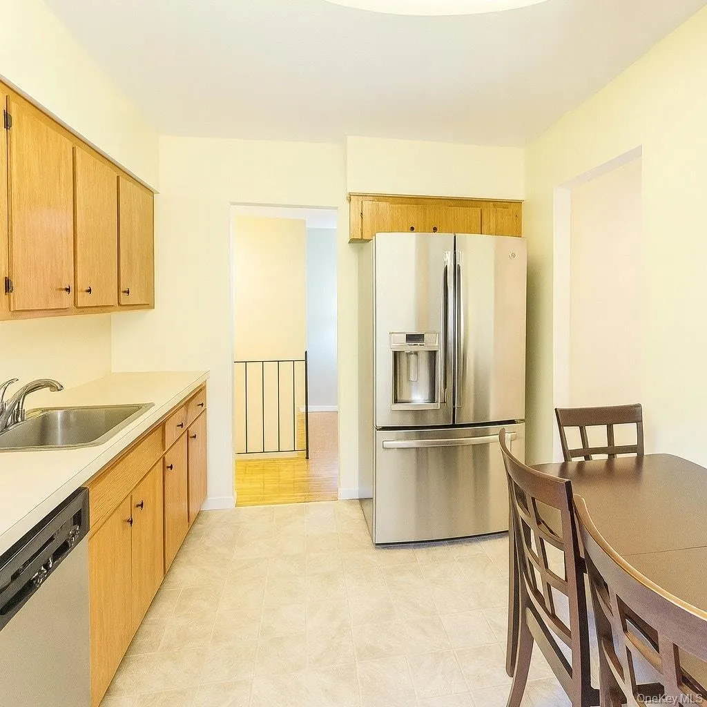 Kitchen with stainless steel appliances and light countertops Kitchen with stainless steel appliances and light countertops