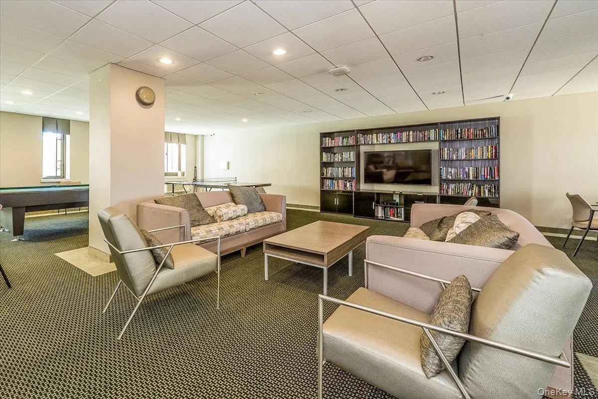 Living room with pool table, carpet floors, and recessed lighting Living room with pool table, carpet floors, and recessed lighting
