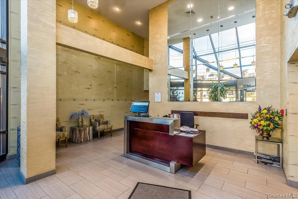 Office area featuring a towering ceiling and recessed lighting Office area featuring a towering ceiling and recessed lighting