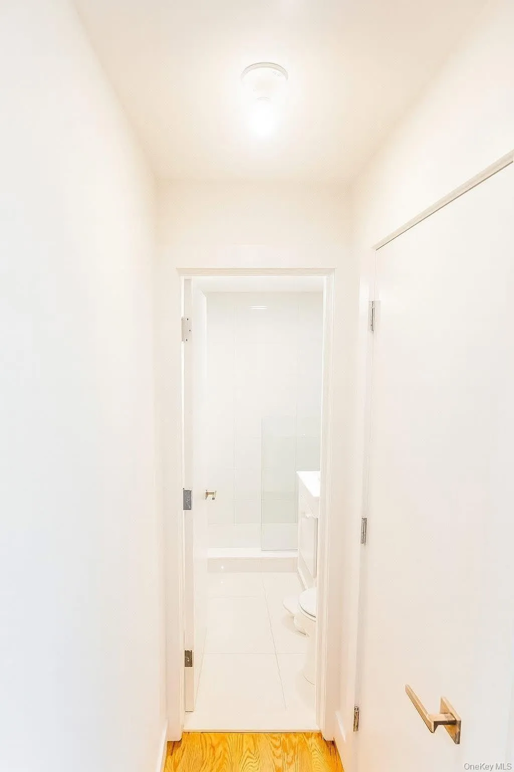 Hall featuring light wood-type flooring Hall featuring light wood-type flooring