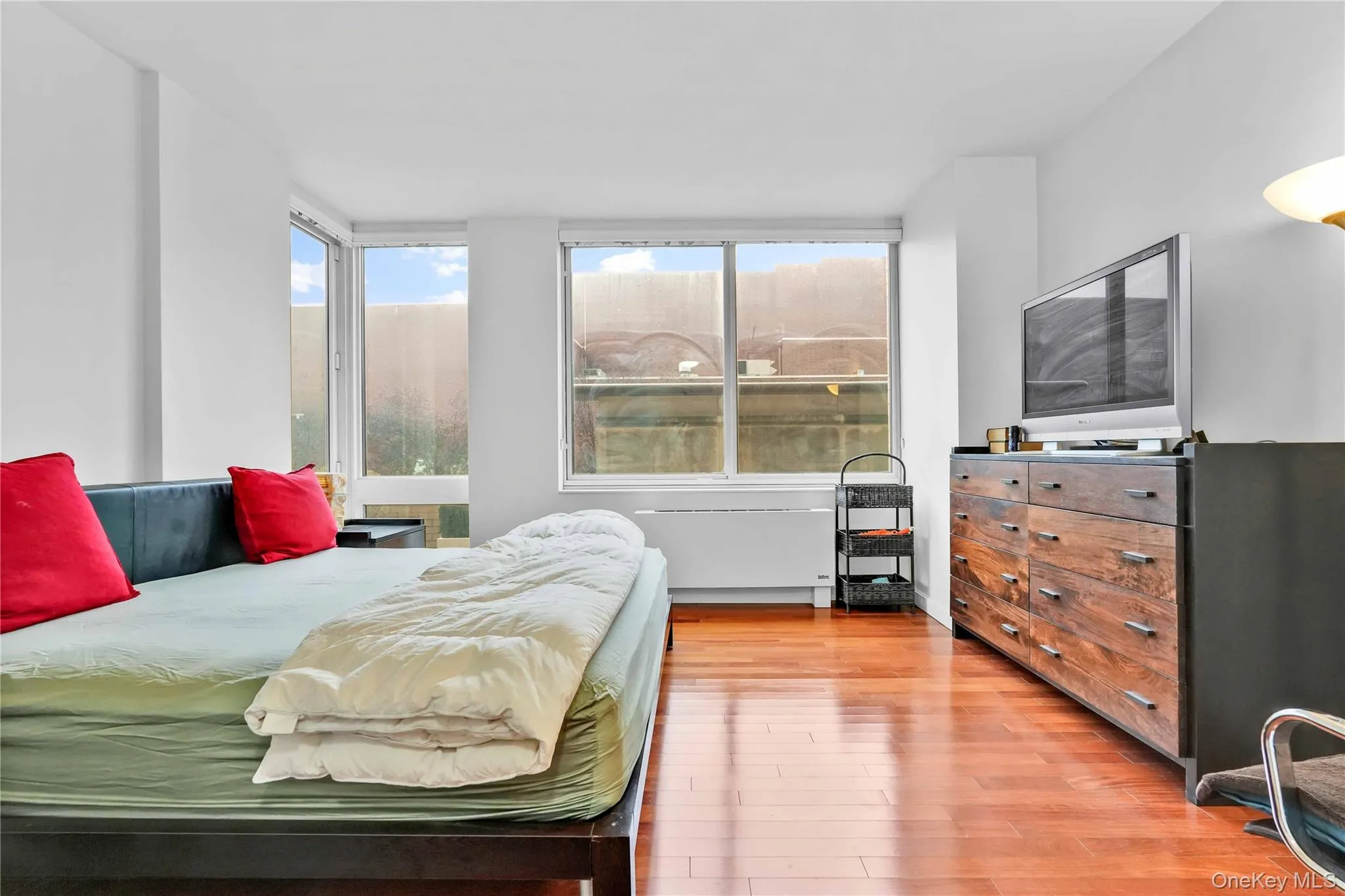Bedroom featuring light wood finished floors Bedroom featuring light wood finished floors