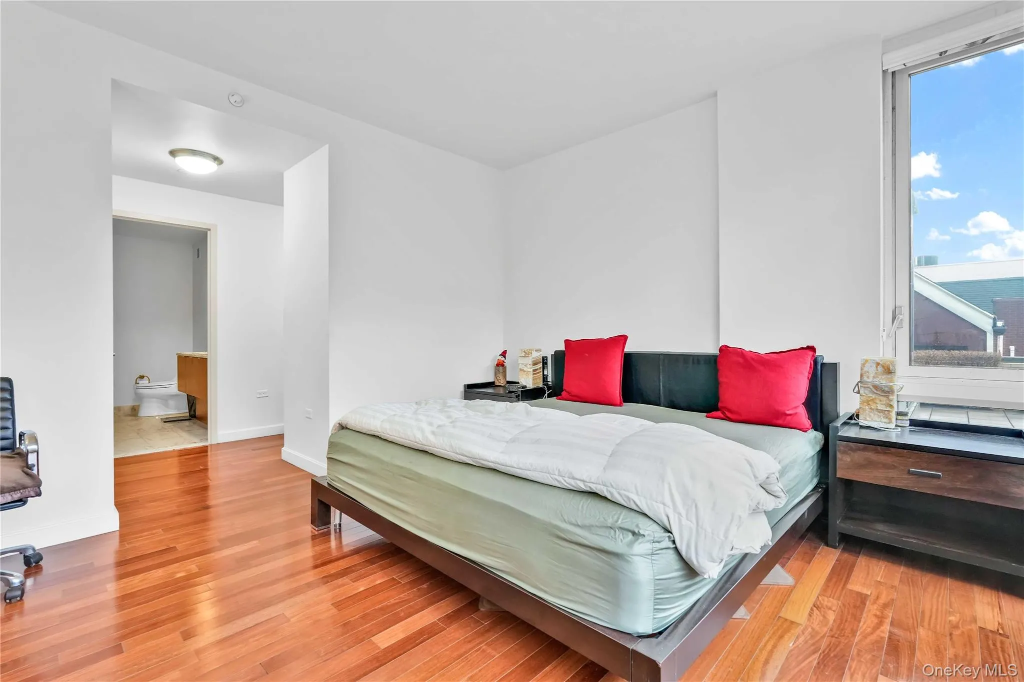 Bedroom with light wood-style flooring Bedroom with light wood-style flooring