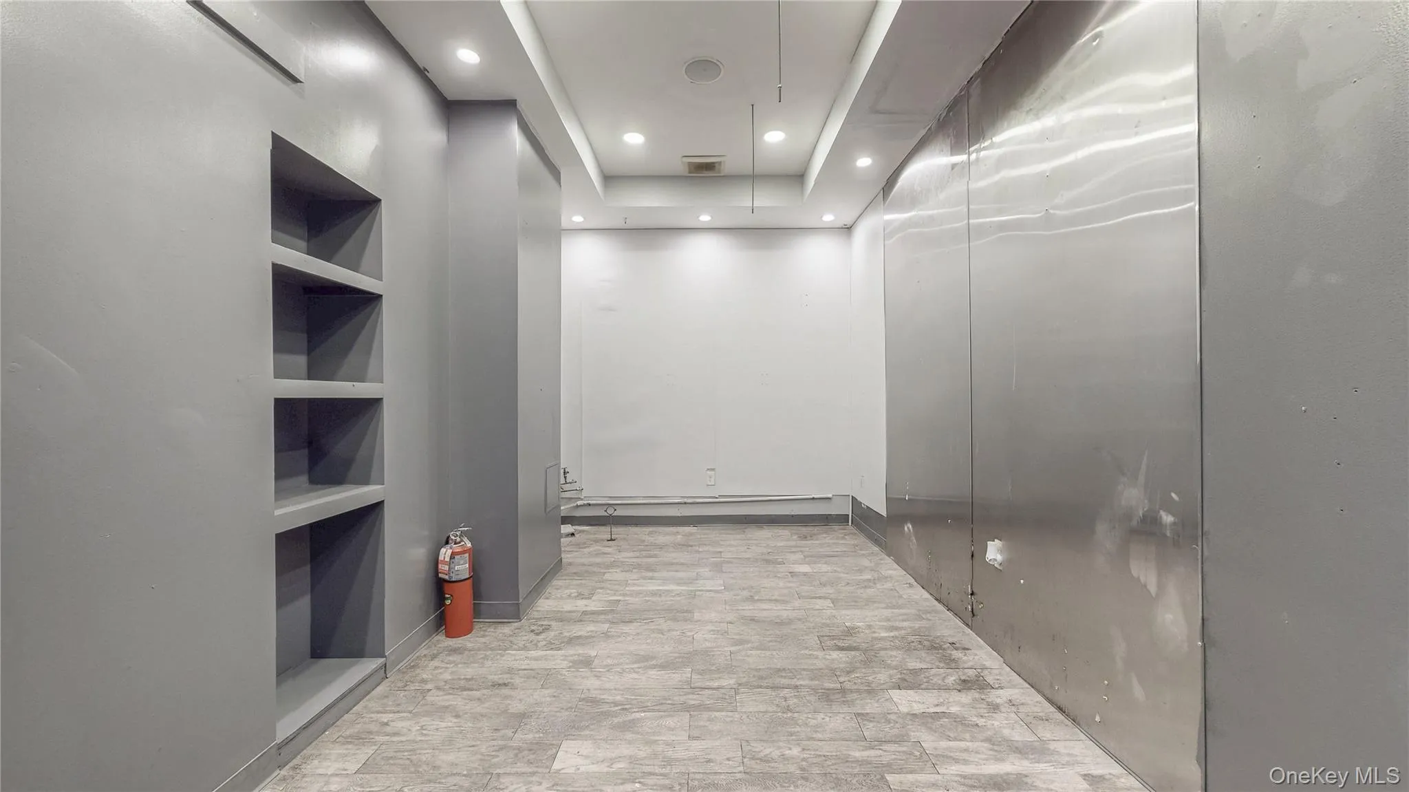 Corridor featuring recessed lighting and elevator Corridor featuring recessed lighting and elevator