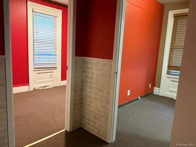 Hall with dark carpet Hall with dark carpet