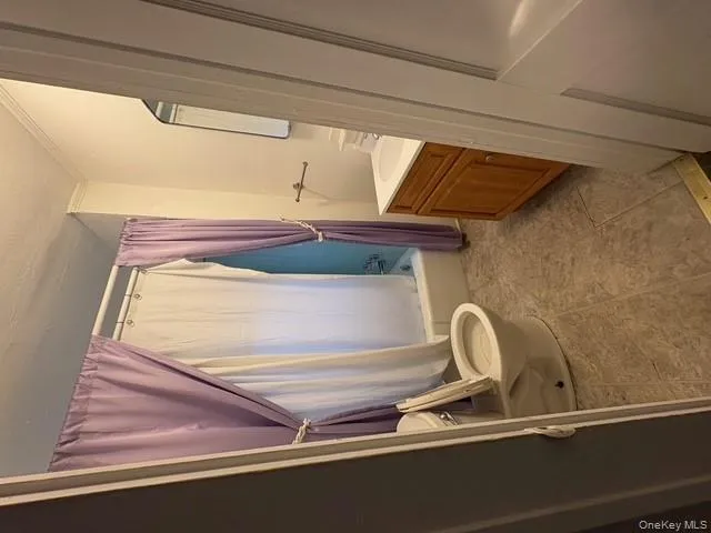 Full bath with vanity, shower / tub combo with curtain, and a textured ceiling Full bath with vanity, shower / tub combo with curtain, and a textured ceiling