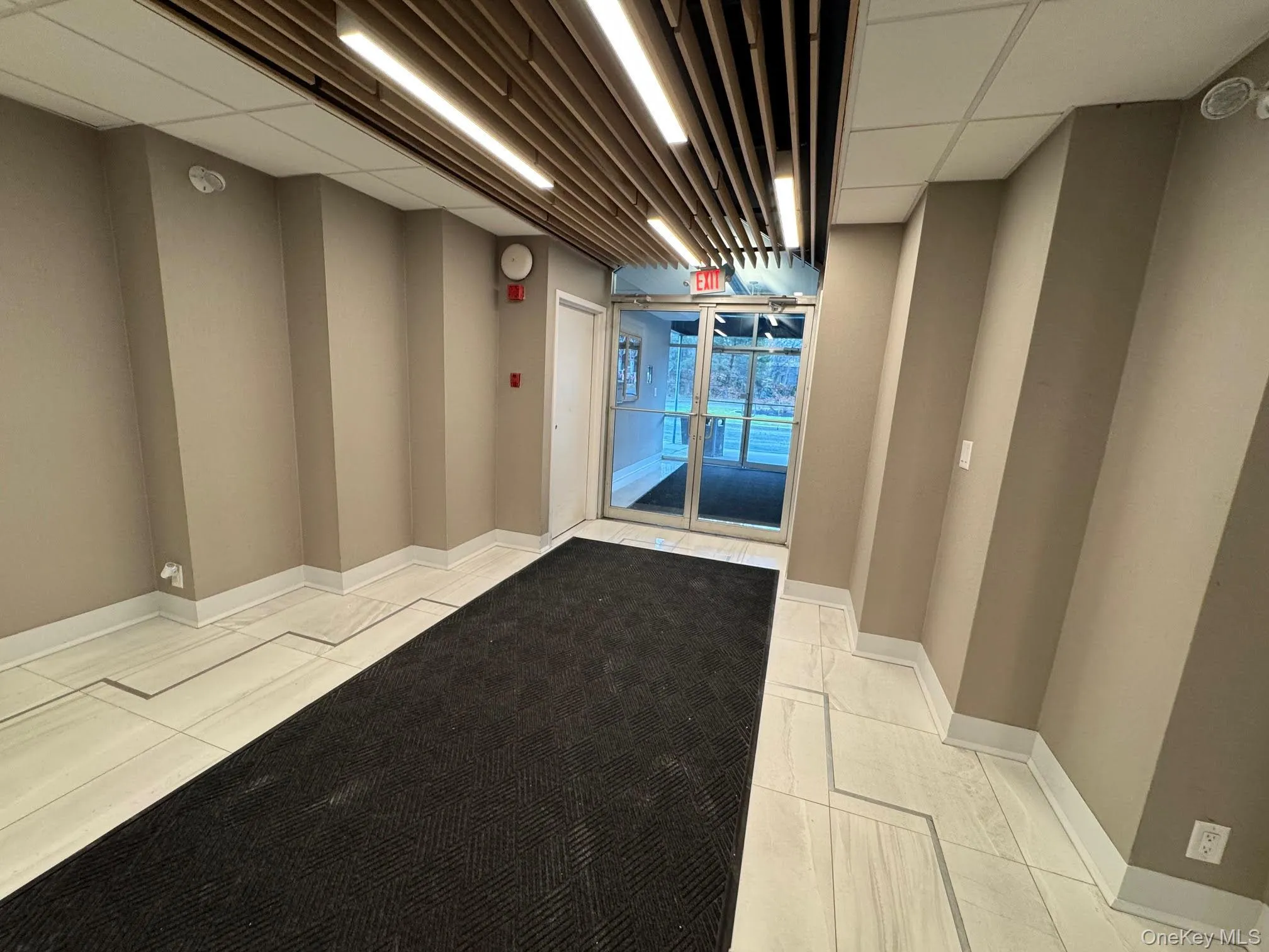 Community lobby with a paneled ceiling Community lobby with a paneled ceiling