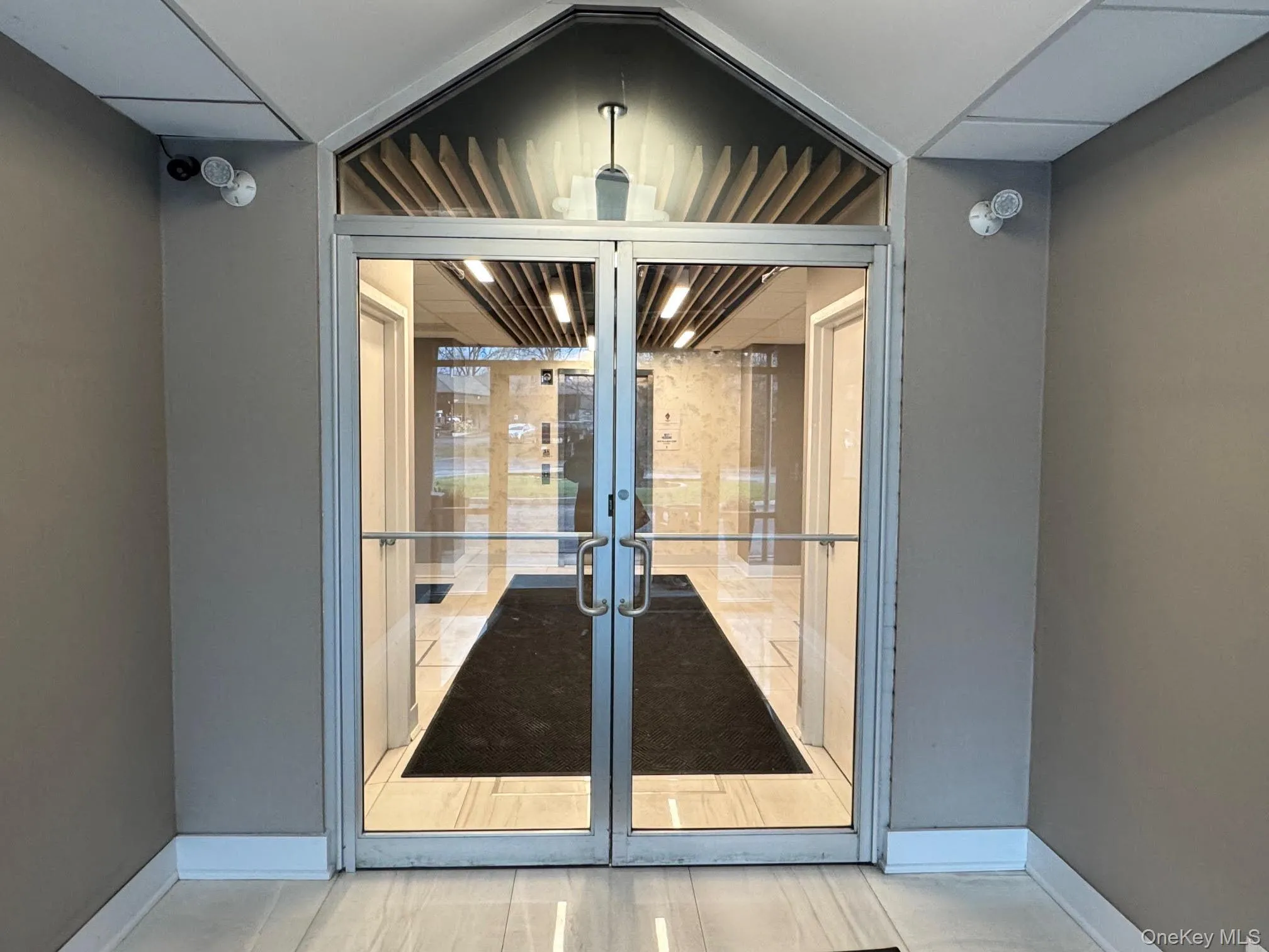 Doorway to property with french doors and elevator Doorway to property with french doors and elevator