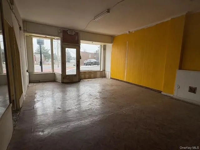 Unfurnished room with concrete floors Unfurnished room with concrete floors