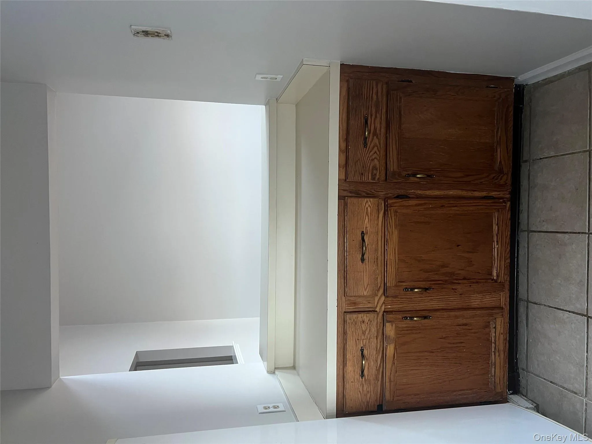 Bathroom featuring vanity and light tile patterned flooring Bathroom featuring vanity and light tile patterned flooring