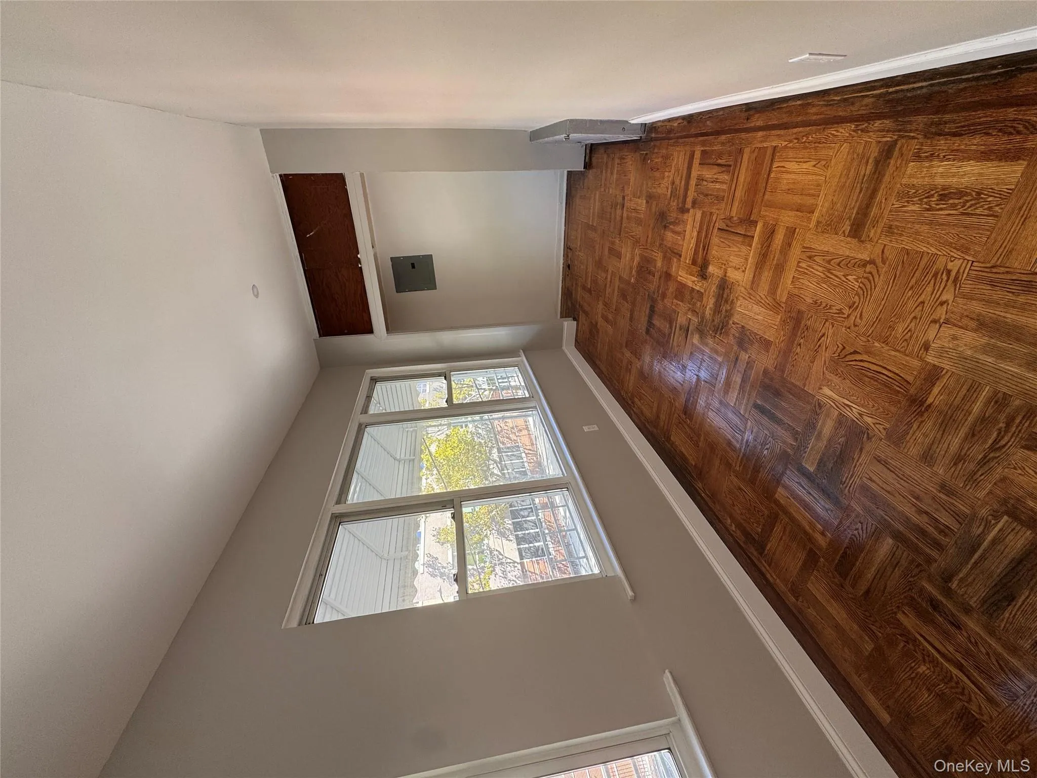 Unfurnished room with baseboards and electric panel Unfurnished room with baseboards and electric panel