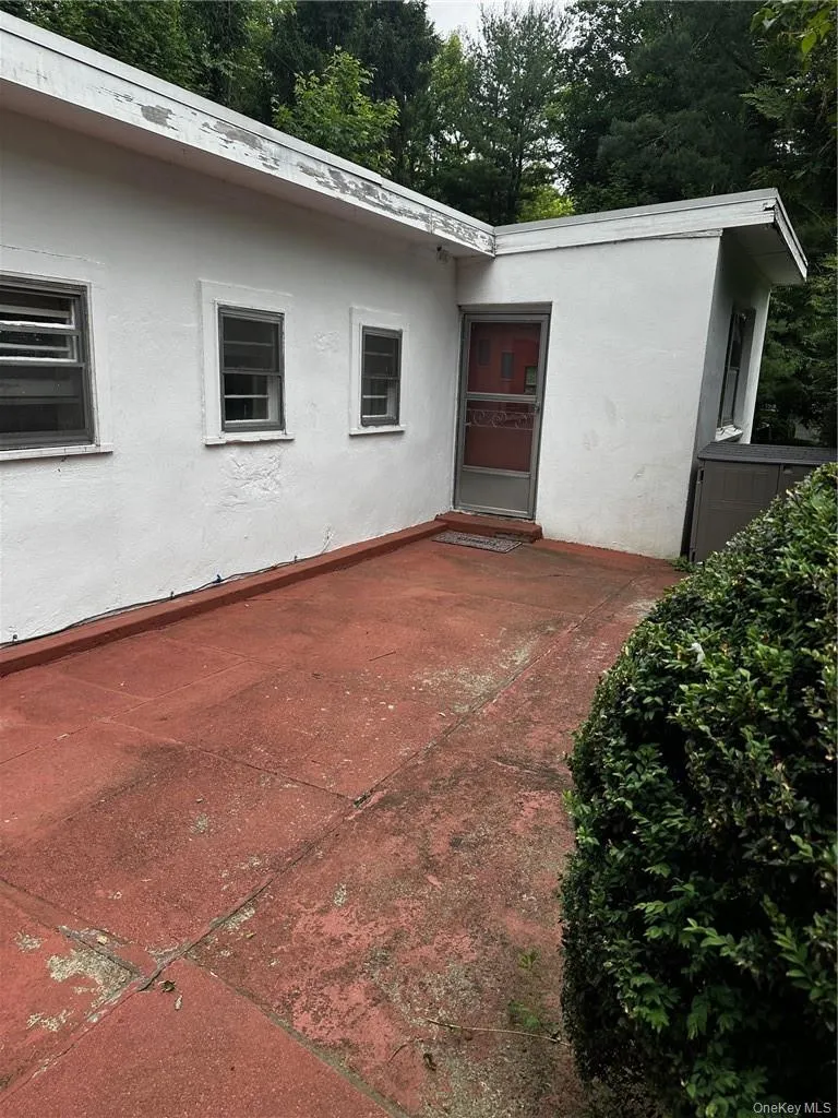 Back of property featuring a patio area Back of property featuring a patio area