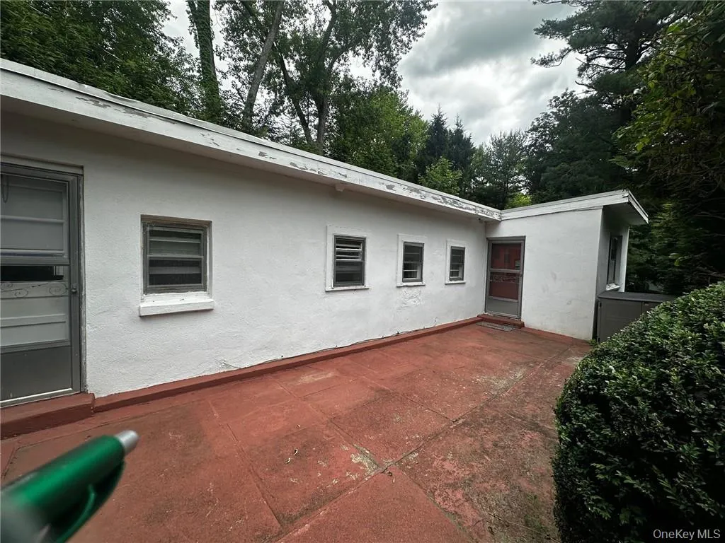 Back of property featuring a patio Back of property featuring a patio