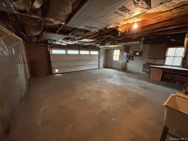 Garage featuring electric panel Garage featuring electric panel