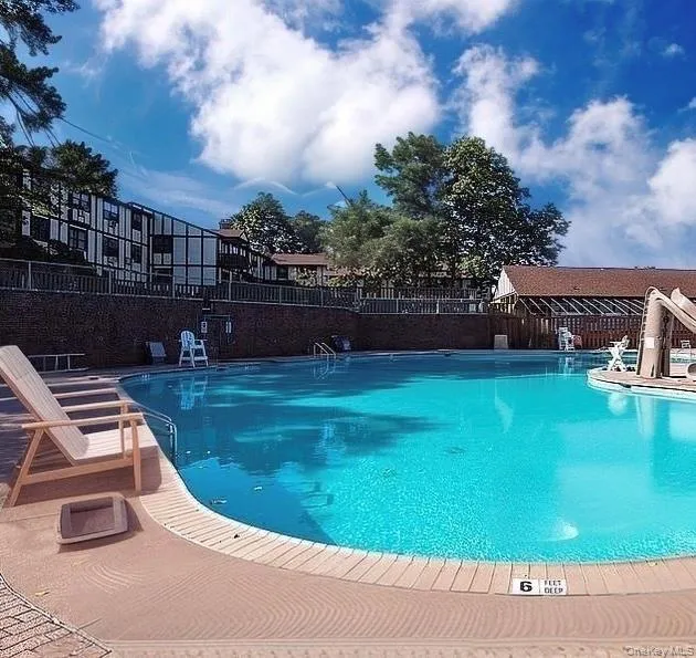 Community pool featuring a patio area Community pool featuring a patio area