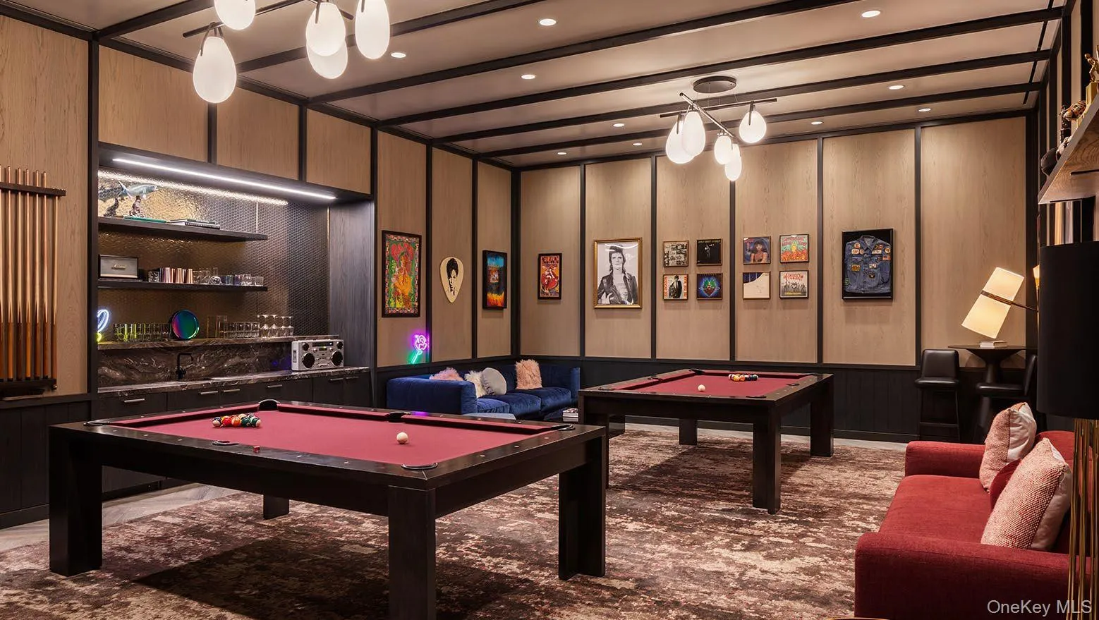 Recreation room featuring pool table, beam ceiling, wooden walls, and carpet Recreation room featuring pool table, beam ceiling, wooden walls, and carpet