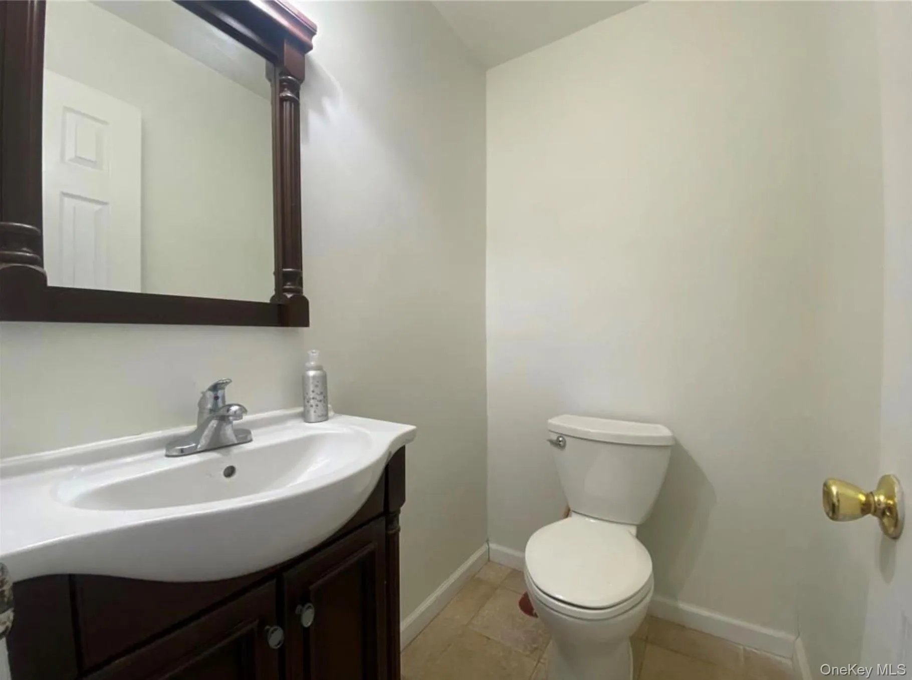 Bathroom featuring vanity and light tile patterned floors Bathroom featuring vanity and light tile patterned floors