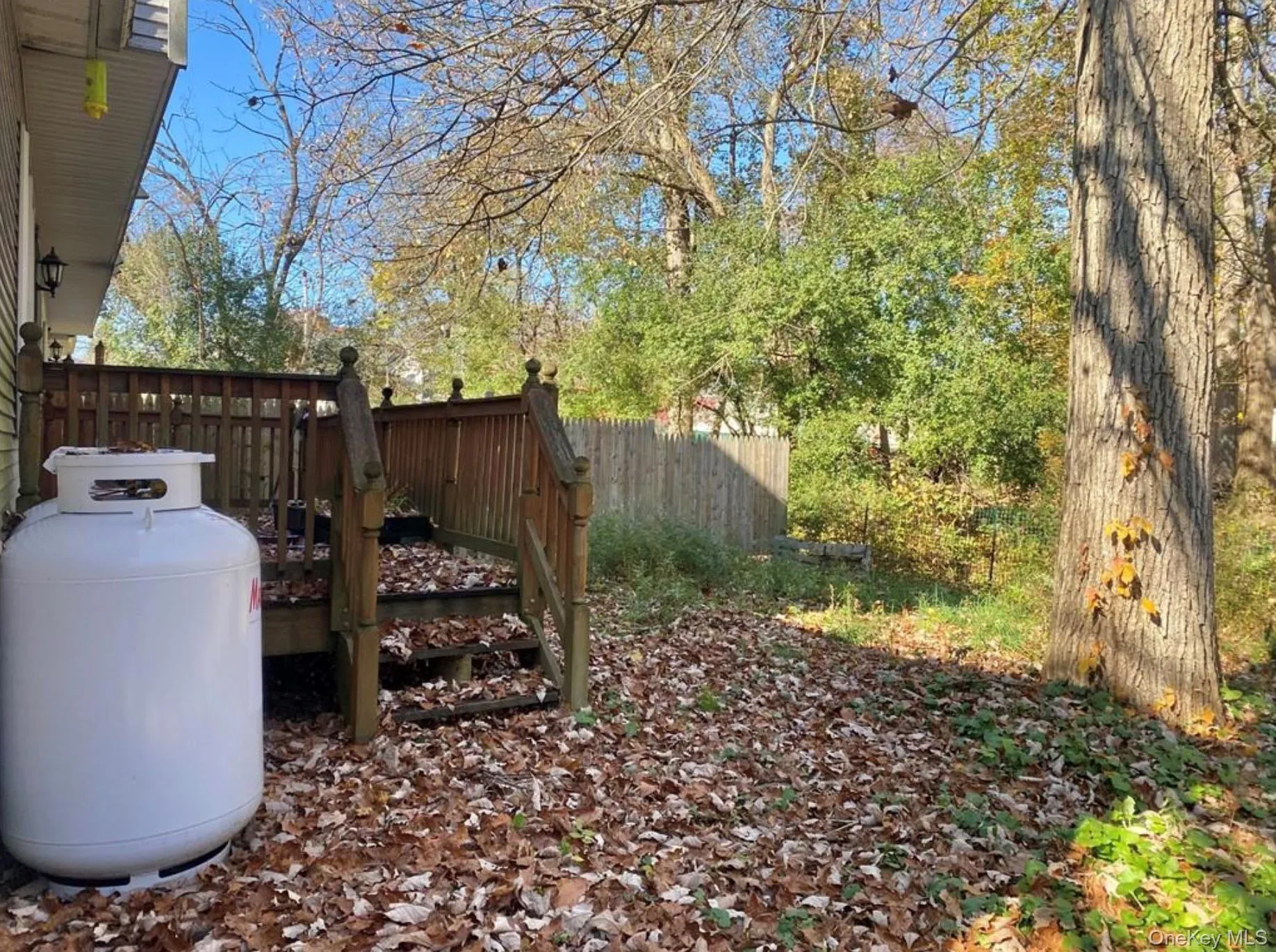 View of yard with a wooden deck View of yard with a wooden deck