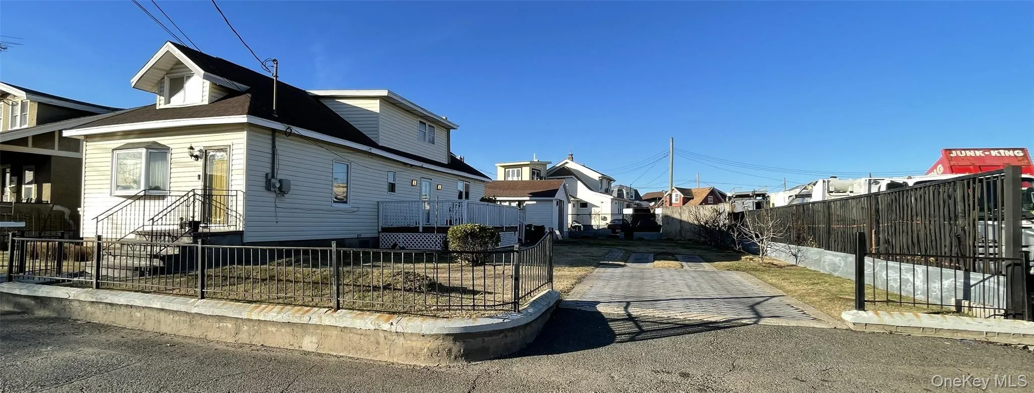 View of property exterior with a fenced front yard and a residential view View of property exterior with a fenced front yard and a residential view