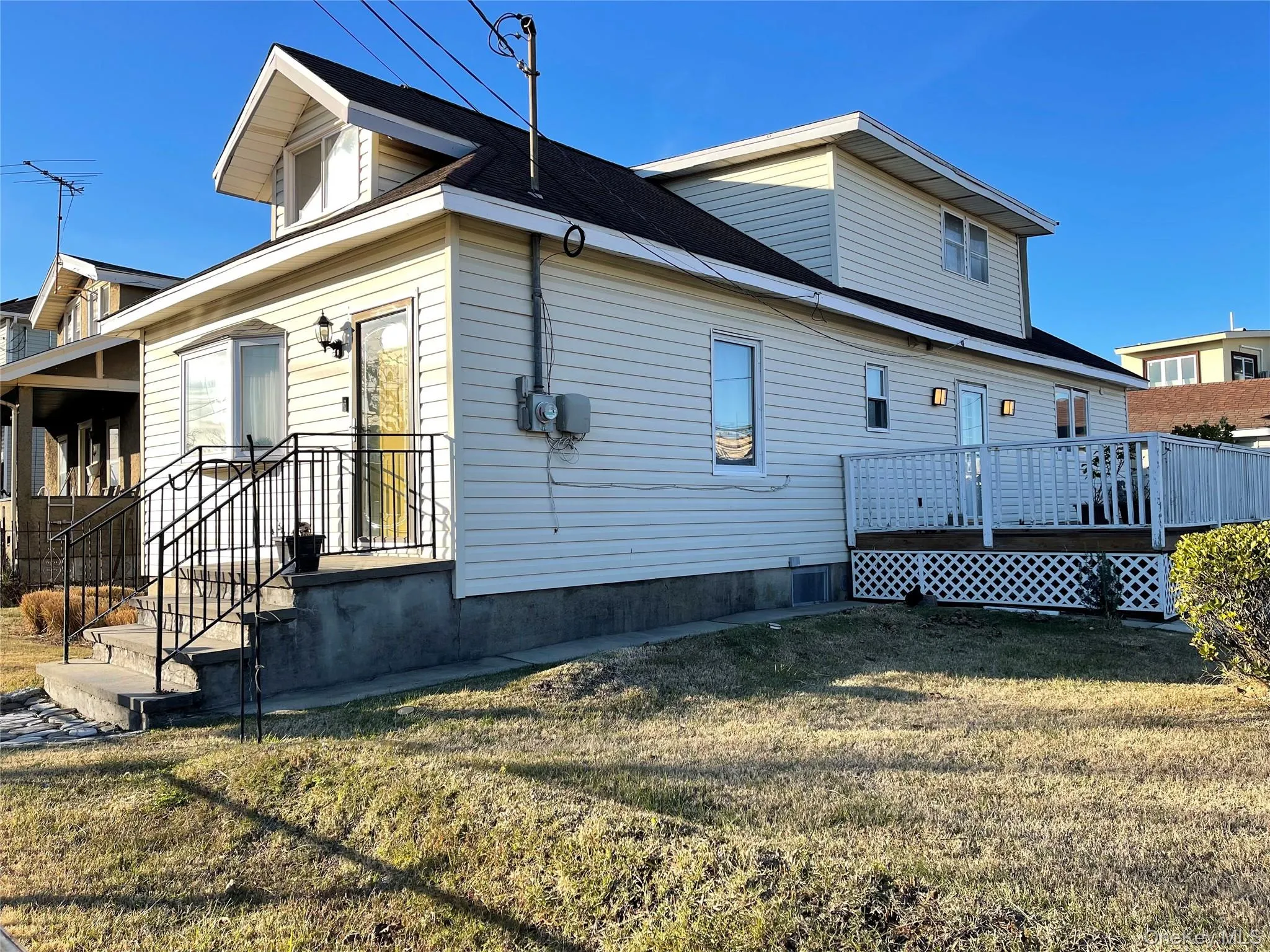 View of side of property featuring a lawn View of side of property featuring a lawn