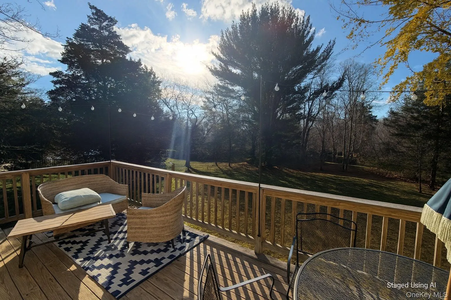 Wooden terrace featuring a lawn Wooden terrace featuring a lawn